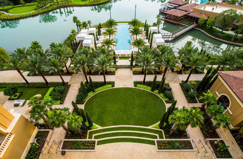 ©EDSA | Four Seasons Resort Orlando at Walt Disney World | Aerial View of Pool, Lake and Garden